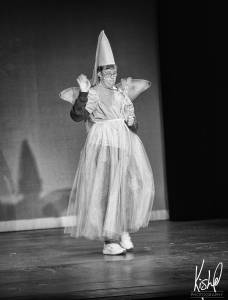 male in skirt with wand in special needs theatre